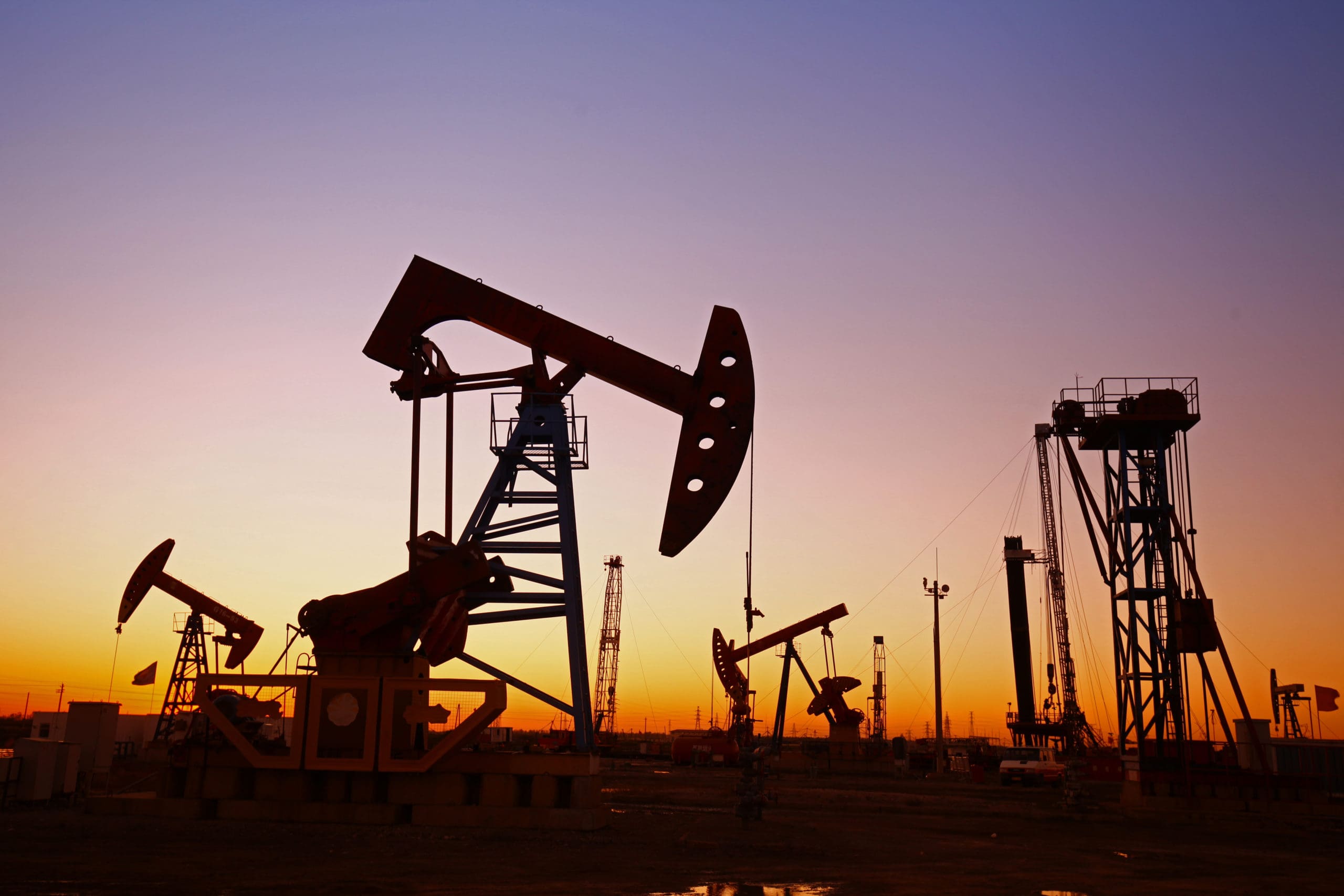 Oil field silhouette at sunset