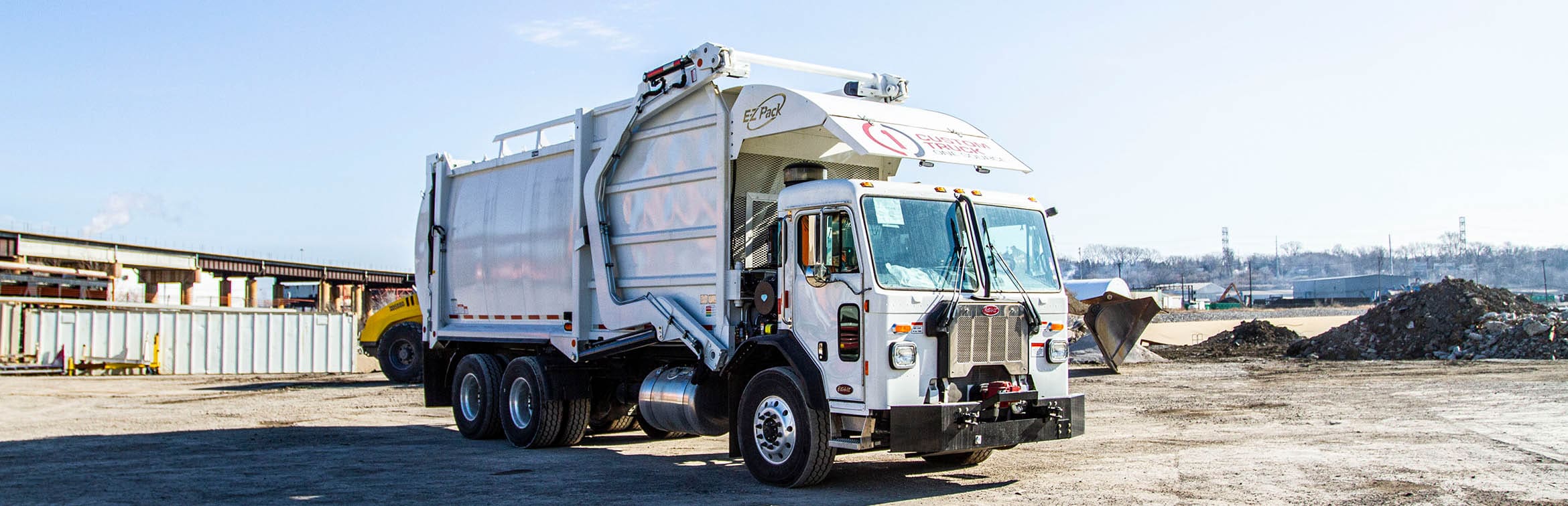 Front-End Loader (FEL) - E-Z Pack Hercules Trash Truck