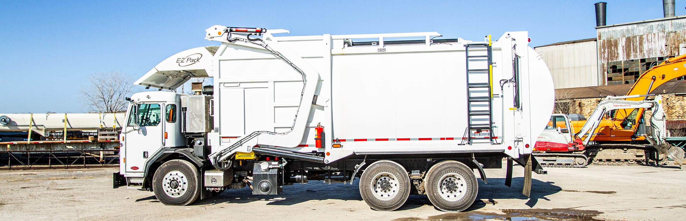 Front-End Loader (FEL) - E-Z Pack Hercules Trash Truck
