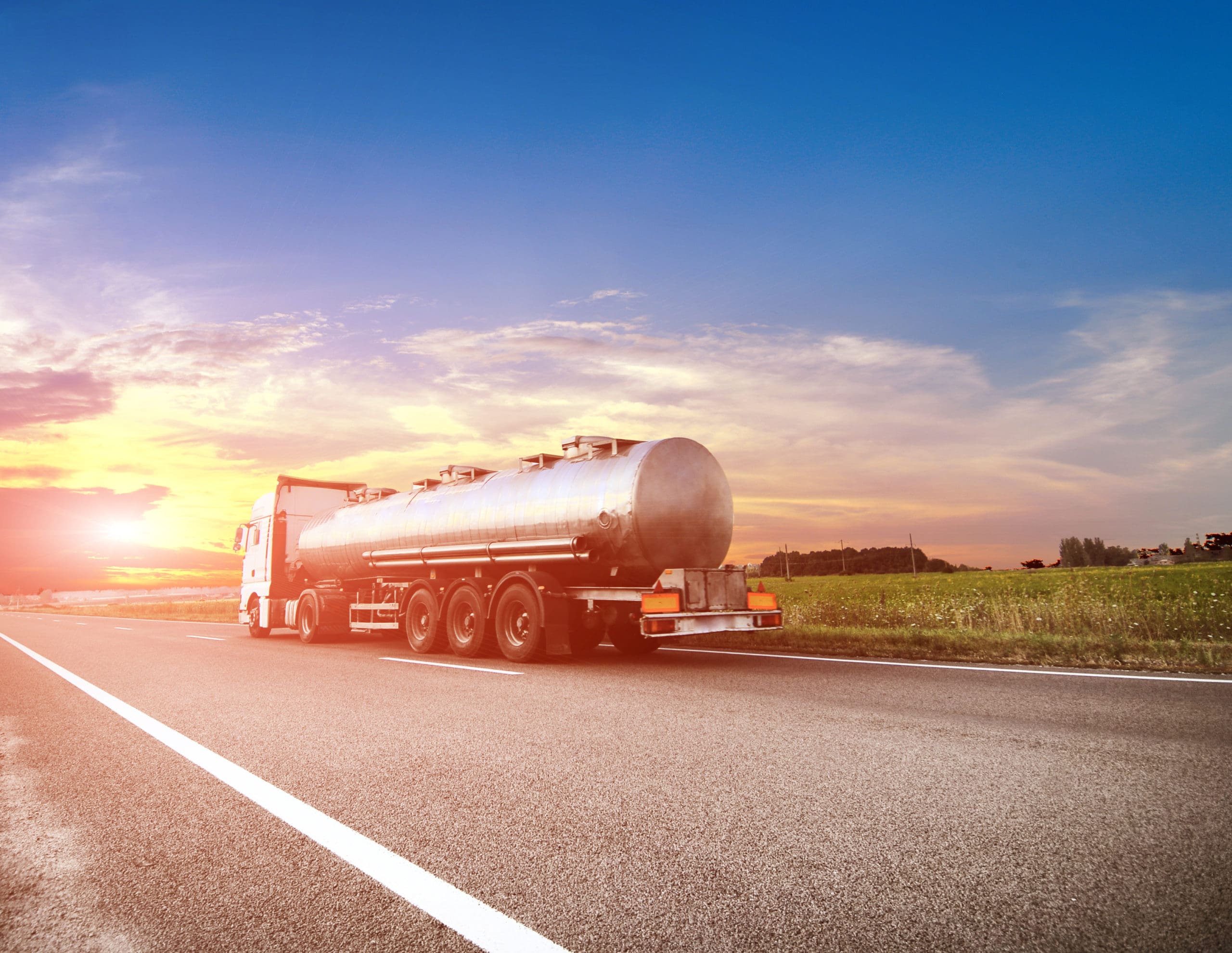 fuel tanker truck driving into the sunset