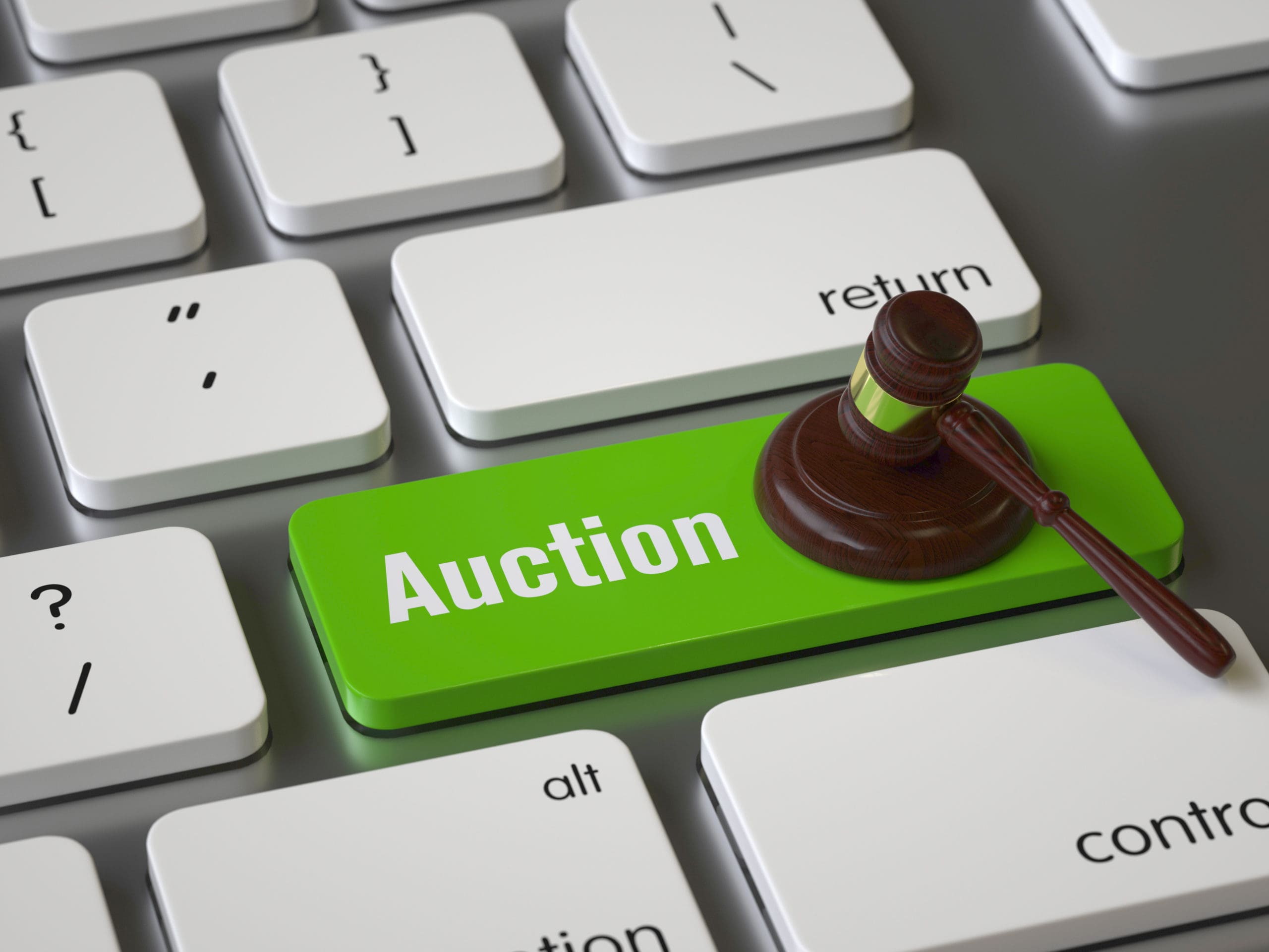 gavel hitting an auction button on a keyboard