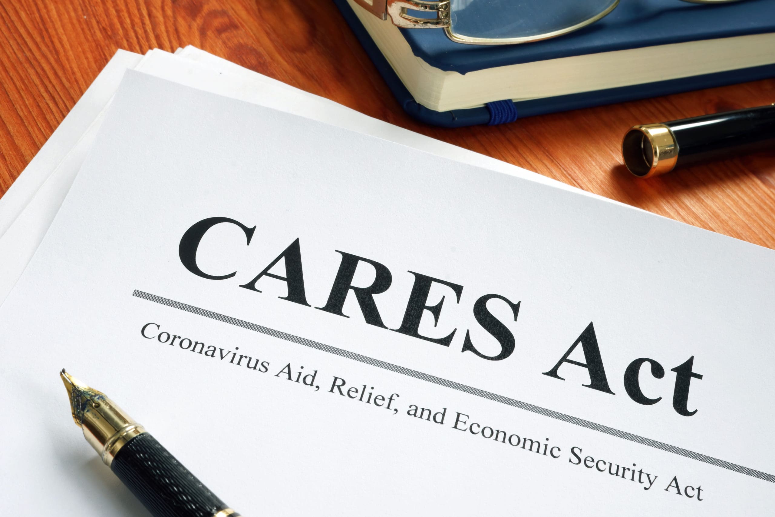 close up of The CARES Act, which could suspend FET requirments, on a desk