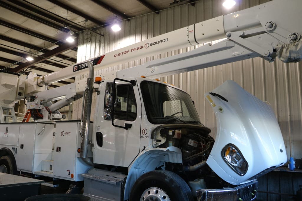 hood of bucket truck opened for repairs to be done