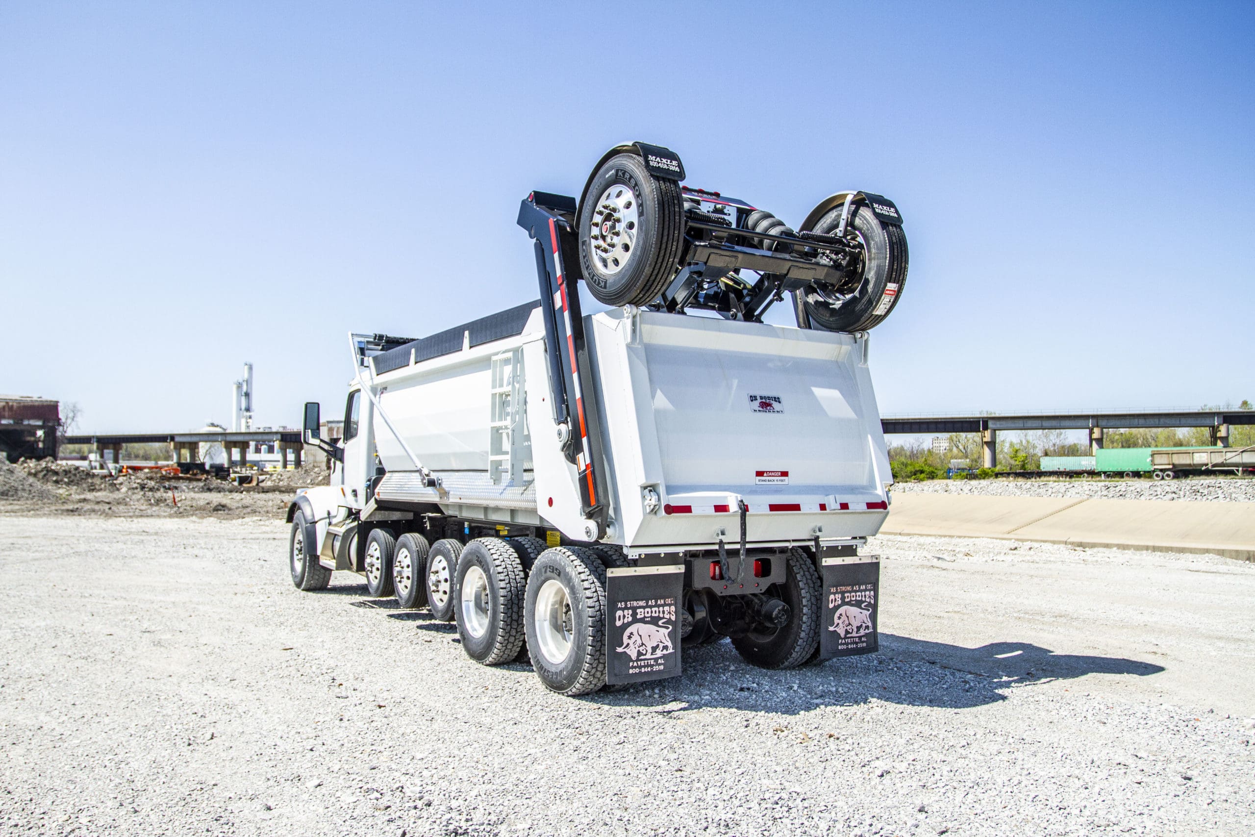 A dump truck with a trailing axle in order to be federal bridge law compliant for larger weights