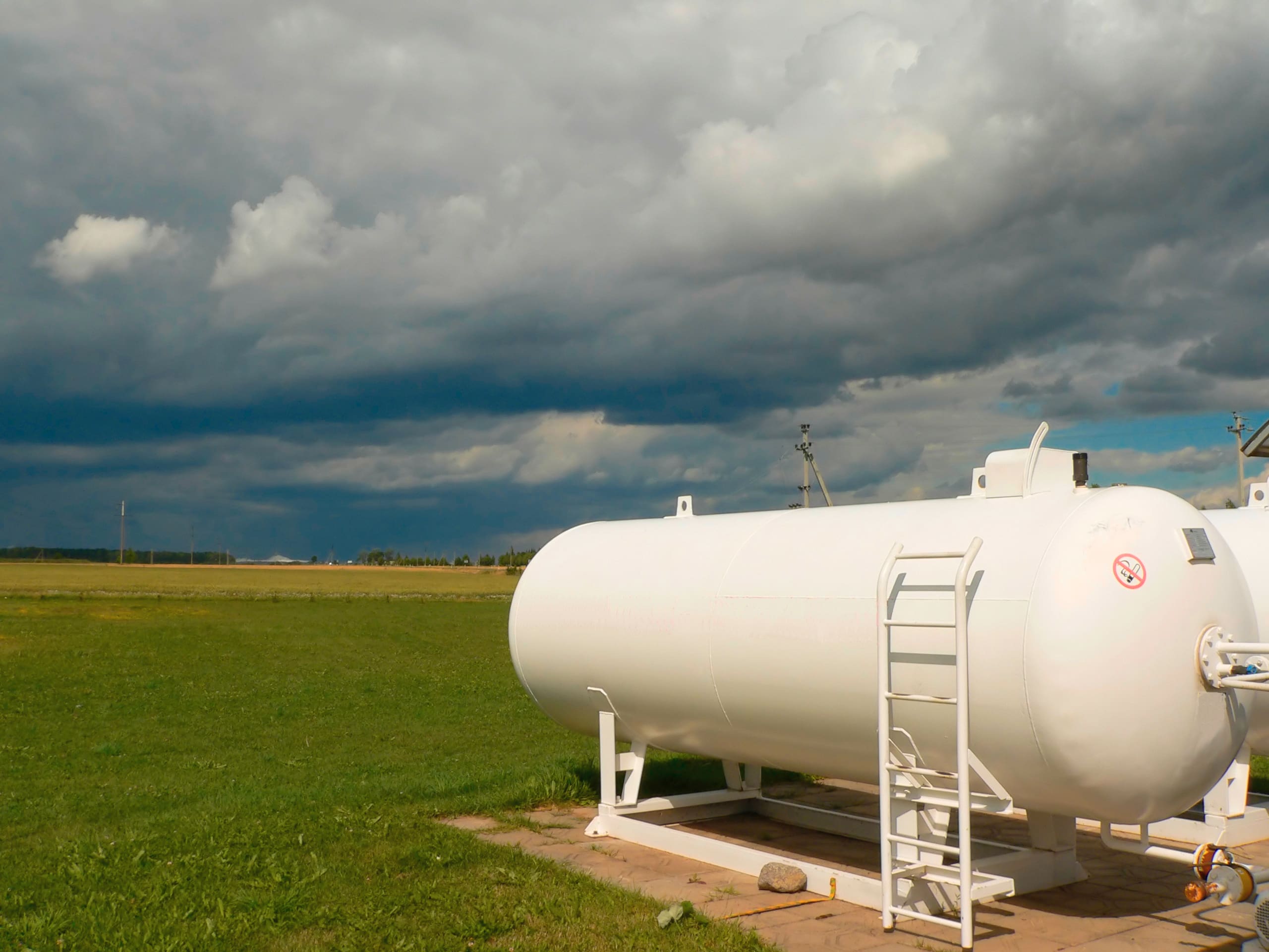 large propane tank in a rural field