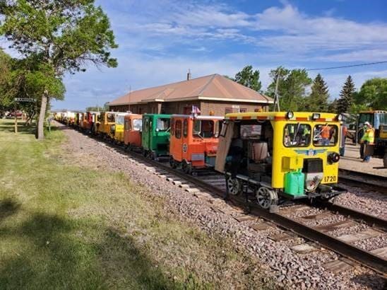 restored speeders on railroad tracks