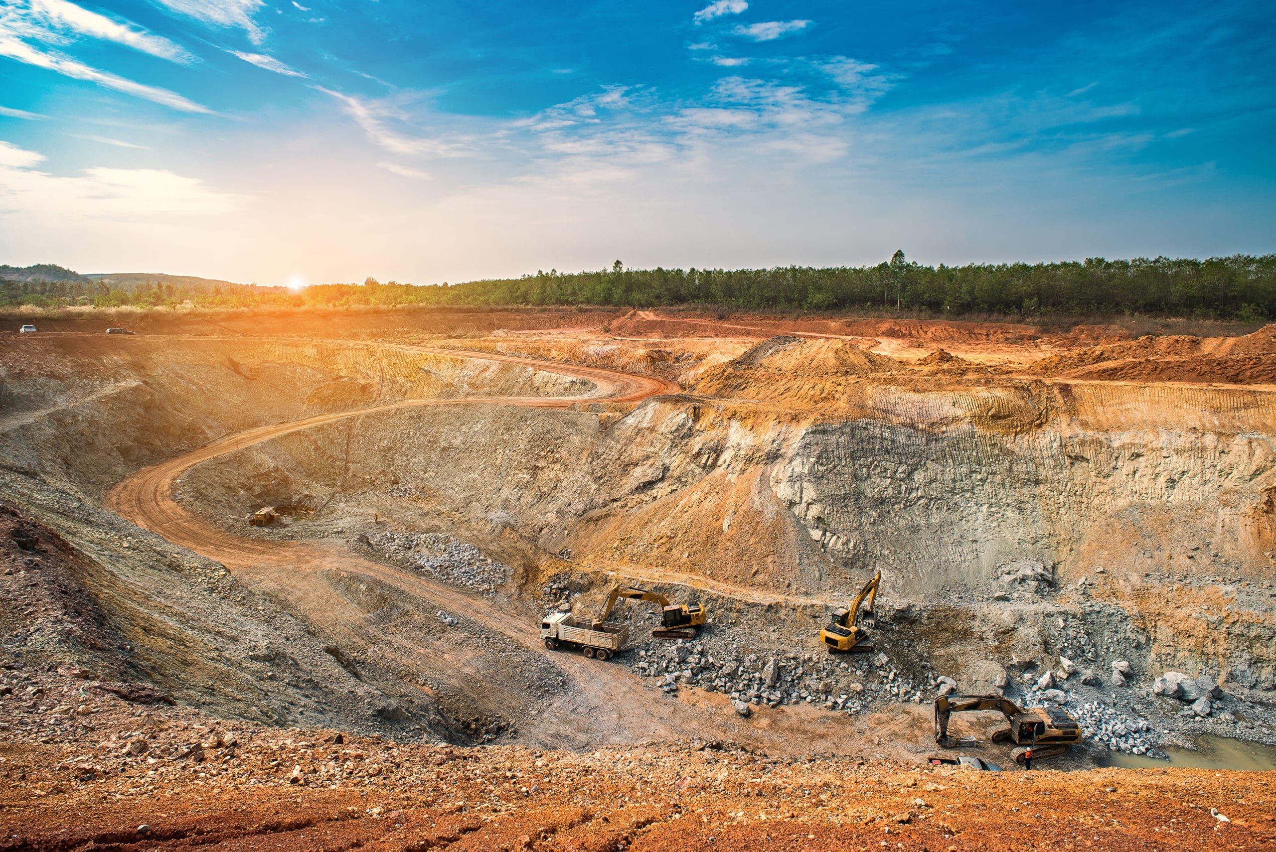 Aerial view of opencast mining quarry with lots of machinery at work - view from above.This area has been mined for copper, silver, gold, and other minerals