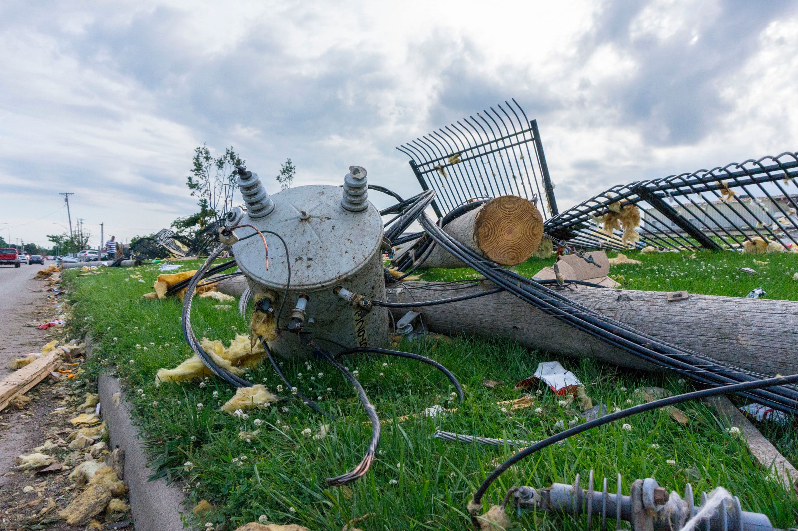 downed powerline following a tornado, utility workers will fix this restoring power to the area